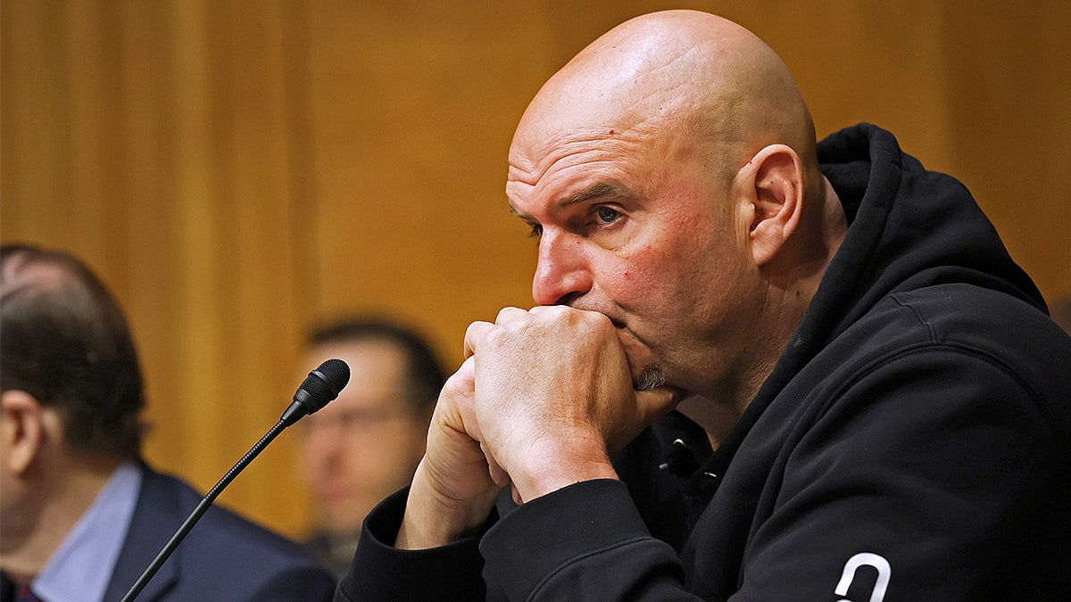Sen. John Fetterman listens during DHS confirmation hearing.